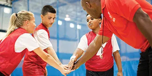 Basketball team breaks a huddle